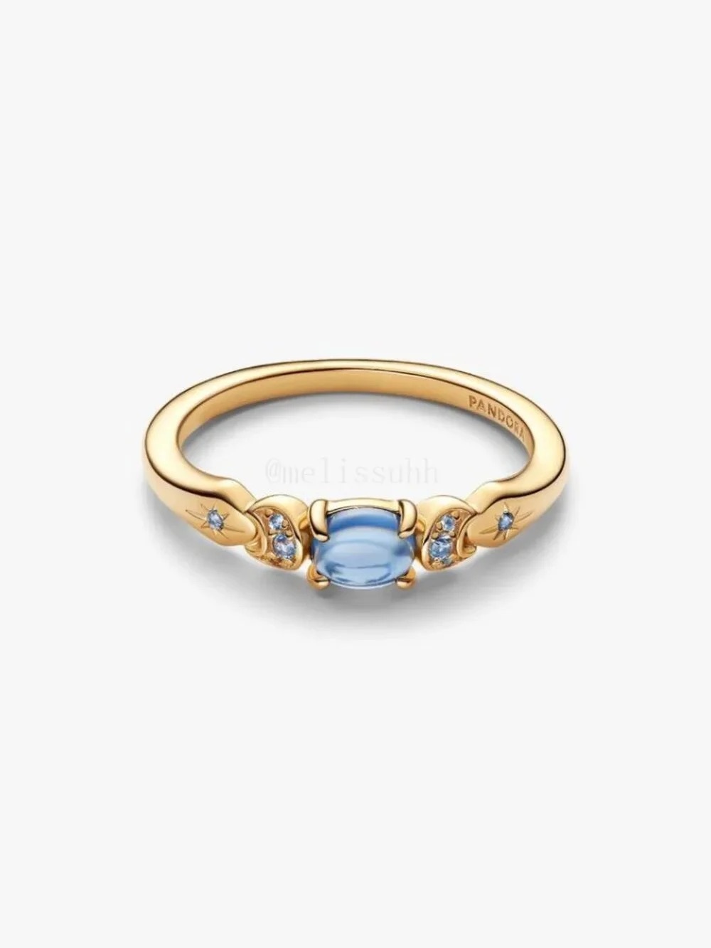 Pandora Gold Tone Ring with Pale Blue Center Stone and Accent Crystals